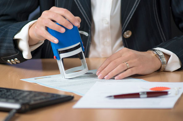 businesswoman stamping document